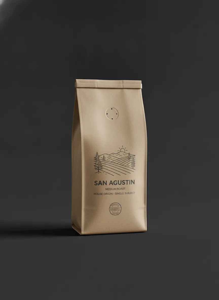 A medium-roast San Agustin coffee bag resting on a near-black surface under a single soft light