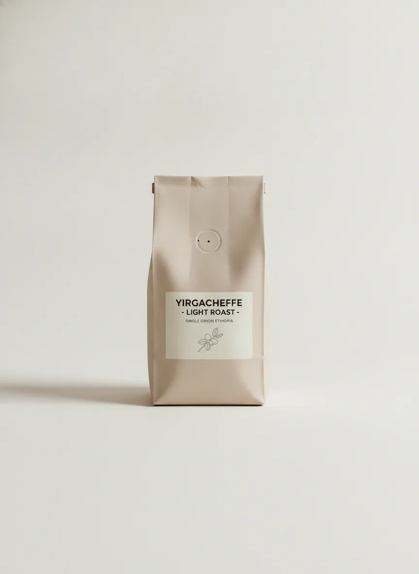 A light-roast Yirgacheffe coffee bag resting on a pale off-white surface under even studio light