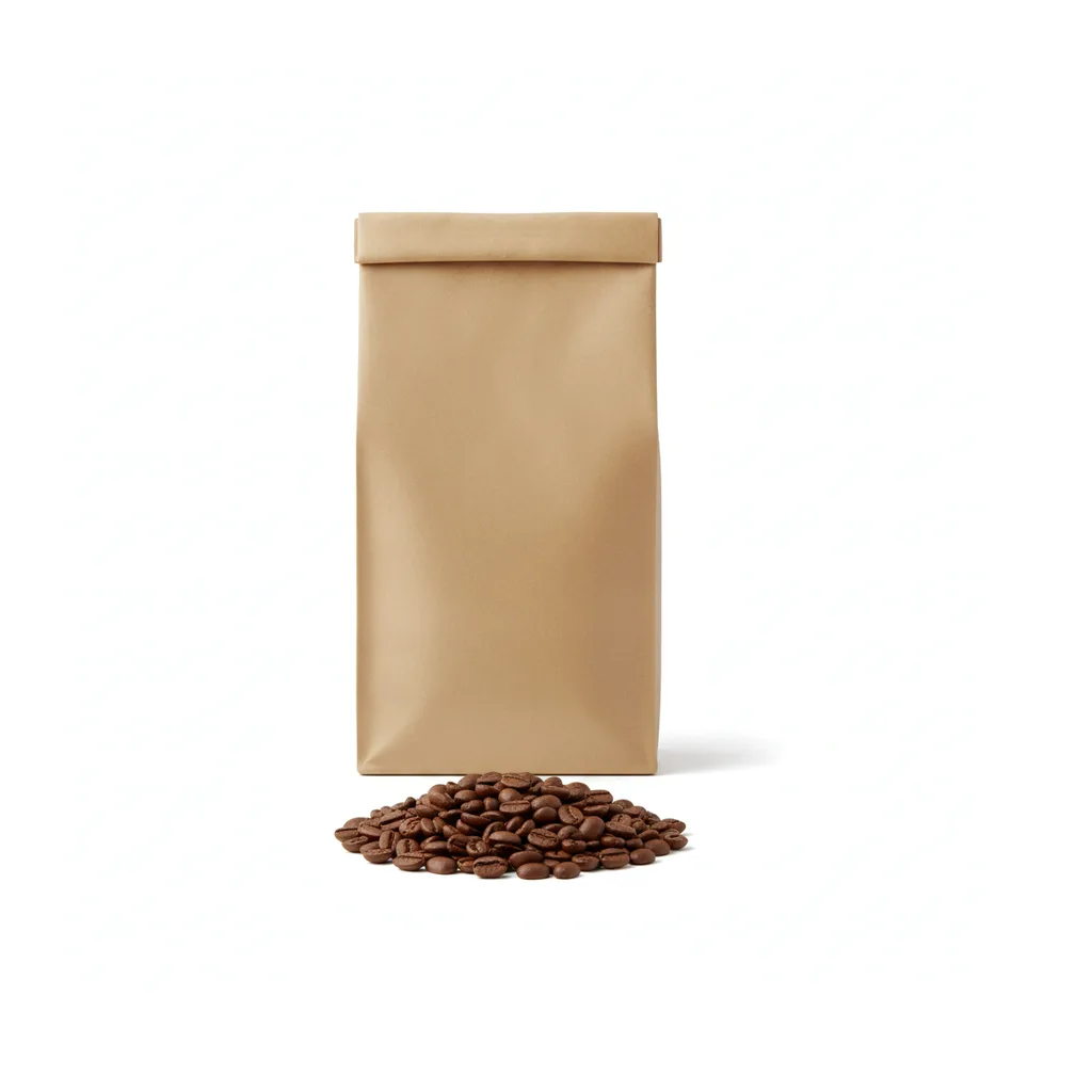 A kraft coffee bag beside a small pile of medium roast beans on white.