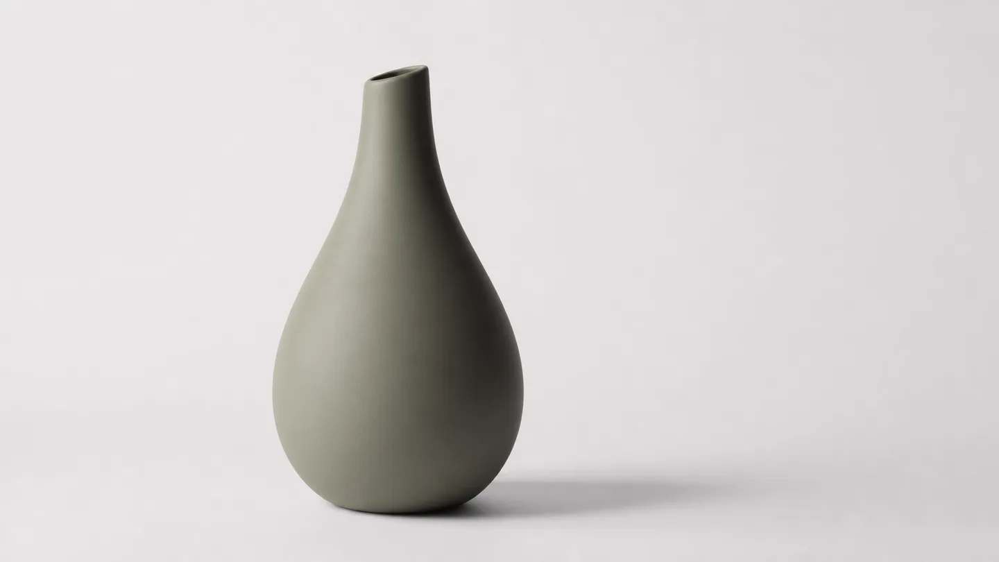 Matte object with long tonal gradients on a pale background